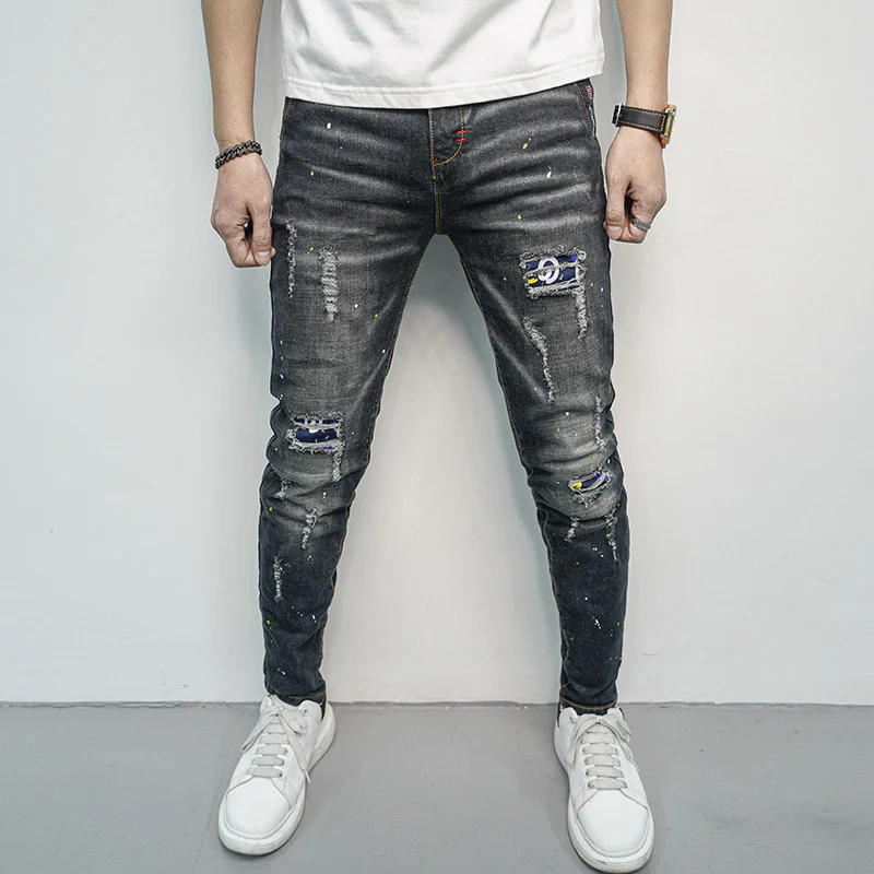 Herren Skinny Fit Jeans im kreativen Rissdesign und bunten Farbsklecks Heidi-Mode